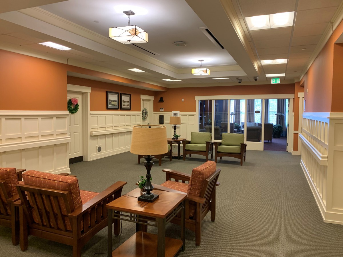 A cozy lobby with comfortable seating and warm lighting.