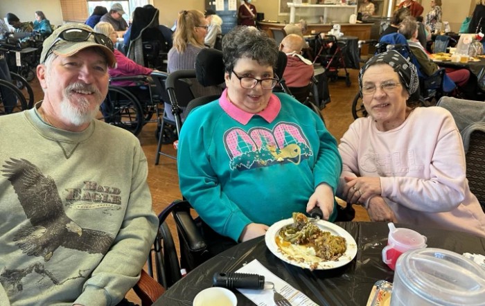 A group of people enjoying a meal together indoors.