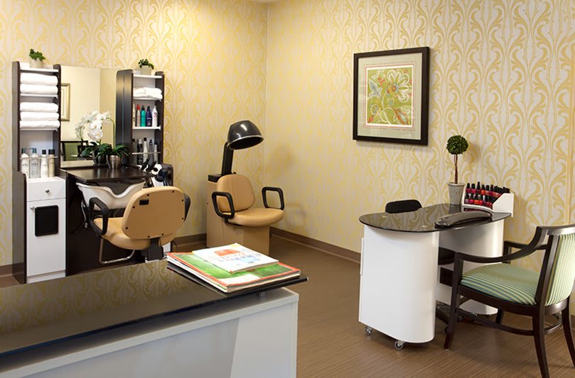 A cozy office space with salon chairs and decor.