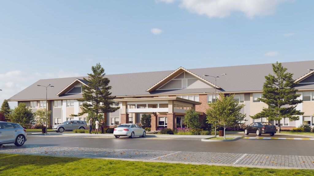 A modern suburban residential building under a clear blue sky.