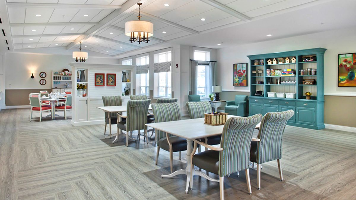 A modern dining room interior with stylish furniture and elegant lighting.
