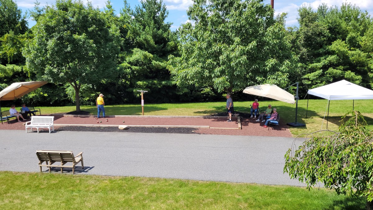 People relaxing and enjoying a sunny day in the park.
