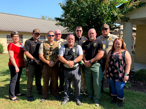 A group of law enforcement officers and community members gathered for a local event.