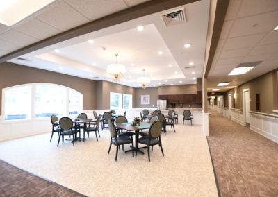 A modern and spacious dining area with multiple tables and chairs.