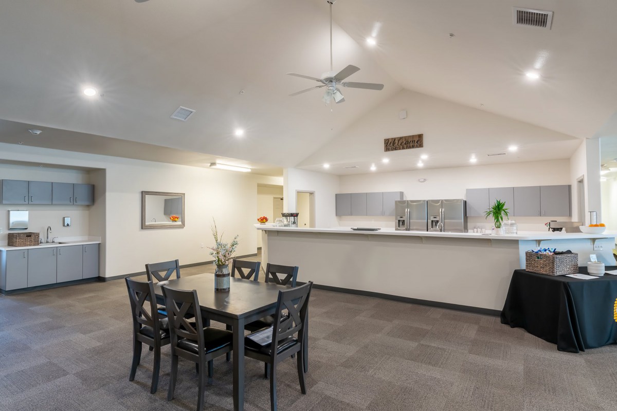 A modern dining and kitchen area with elegant furniture and interior design.
