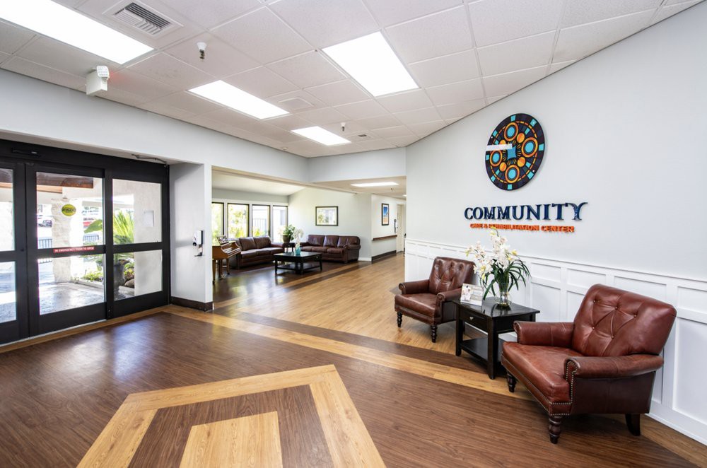 A welcoming lobby with comfortable seating and bright lighting in a community center.