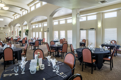 A spacious and elegant dining area with well-set tables and ample natural light.