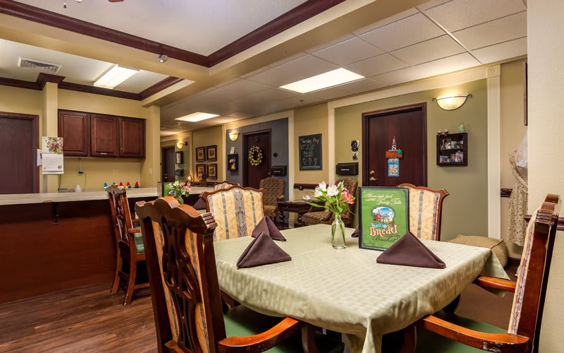 A cozy dining area with elegantly set tables in a restaurant.