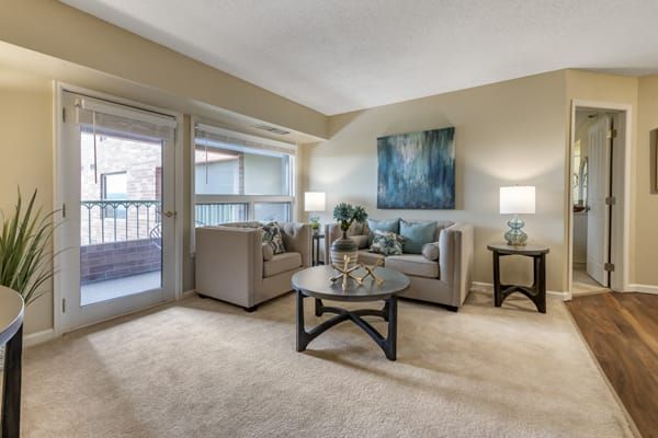 A cozy living room with modern furniture and soft lighting.