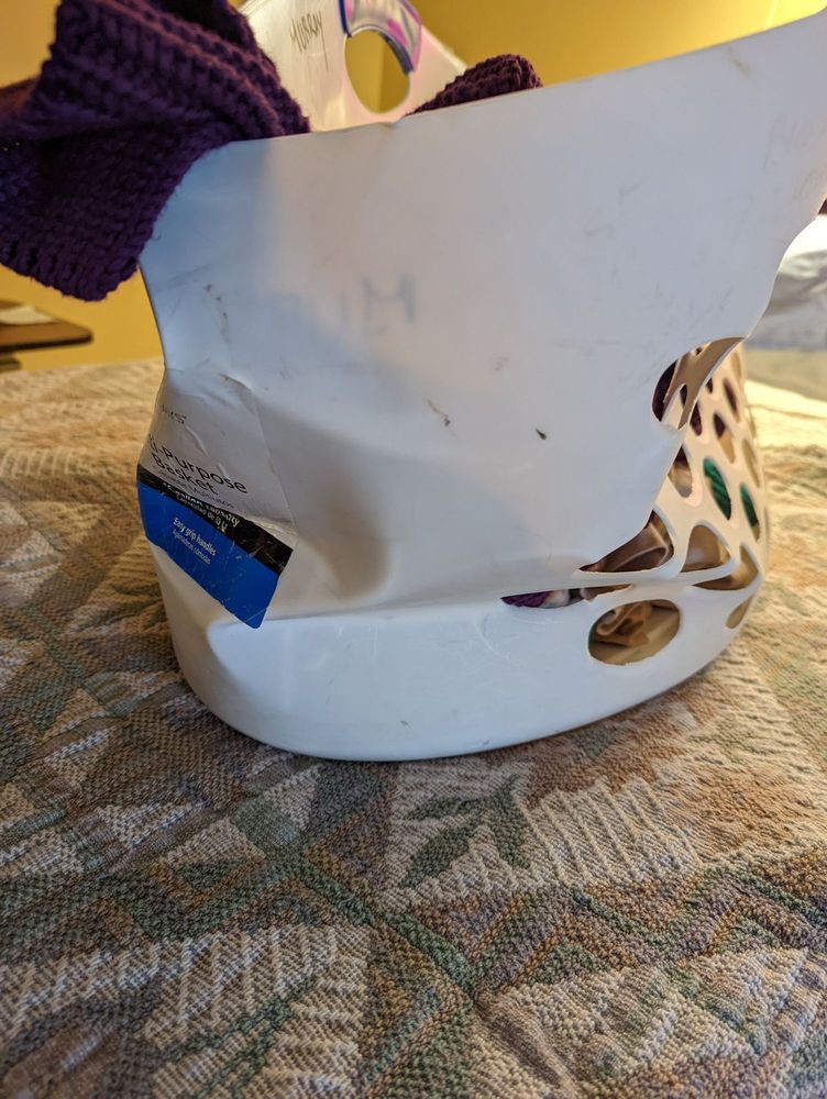 A damaged helmet placed on a table.