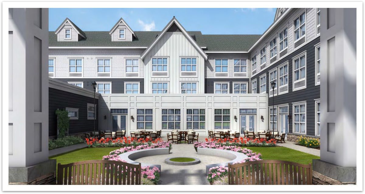 A modern residential building with a landscaped courtyard and garden seating area.