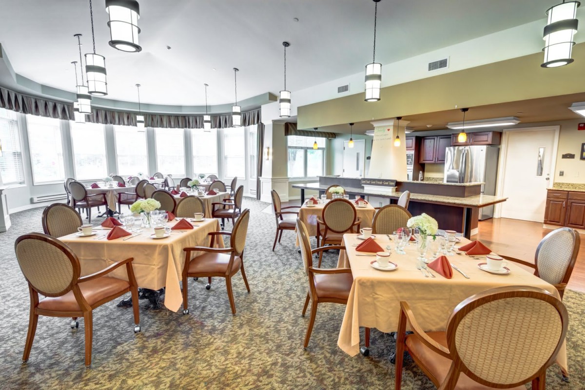 An elegant dining room with neatly arranged tables and chairs, ready for guests.