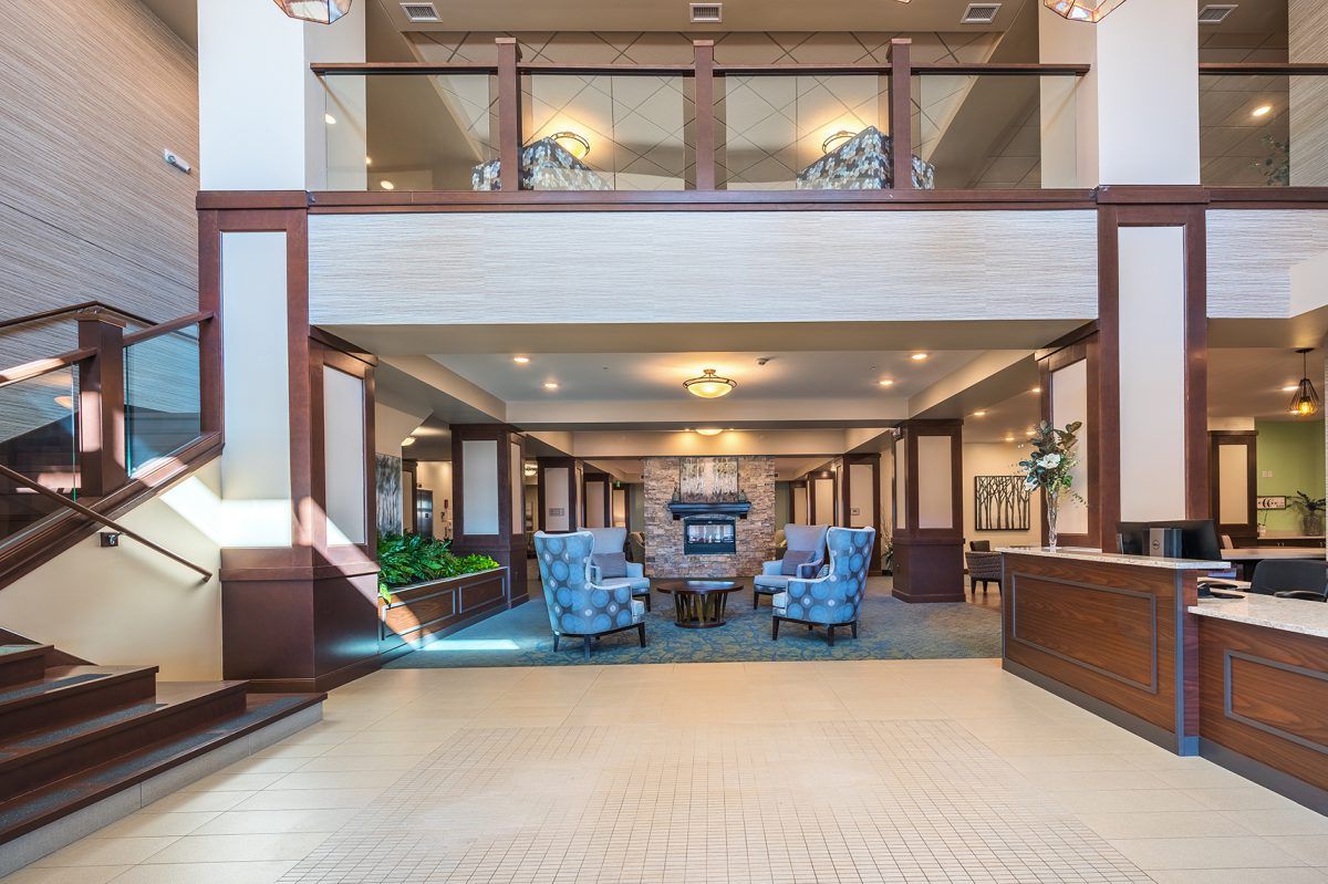 Elegant hotel lobby with comfortable seating and chandeliers.
