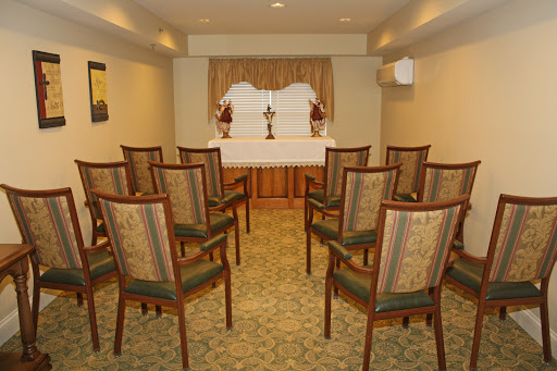 A well-arranged meeting room with chairs set up for an event.
