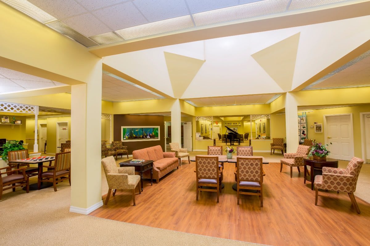 A spacious and elegant lobby with comfortable seating and a grand piano.