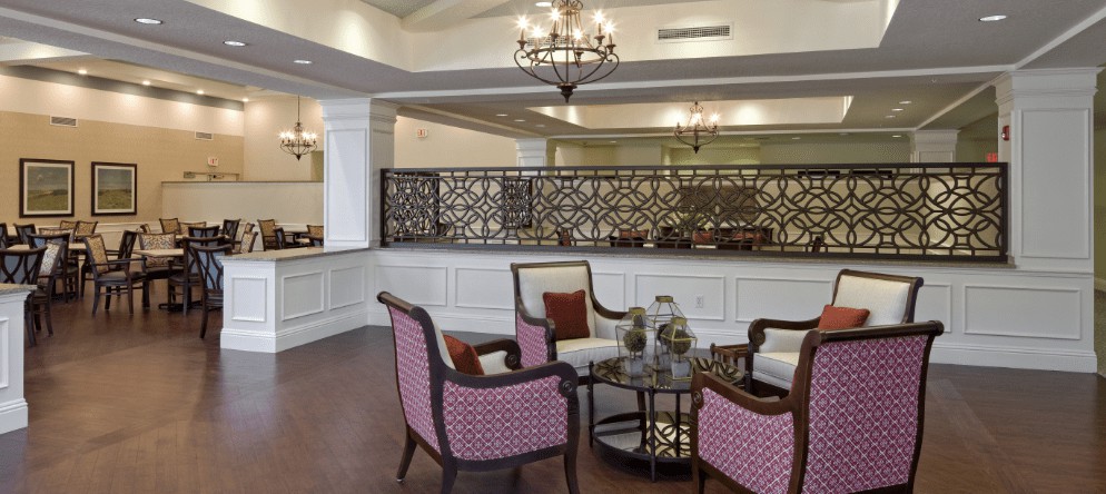 A traditional-style lobby with elegant seating and chandeliers.