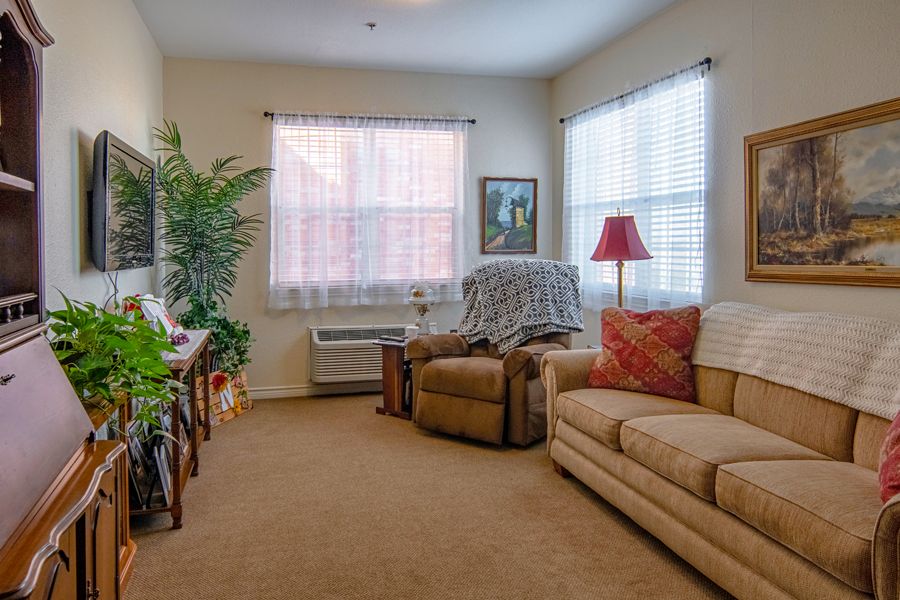 A cozy living room with comfortable seating and soft lighting.
