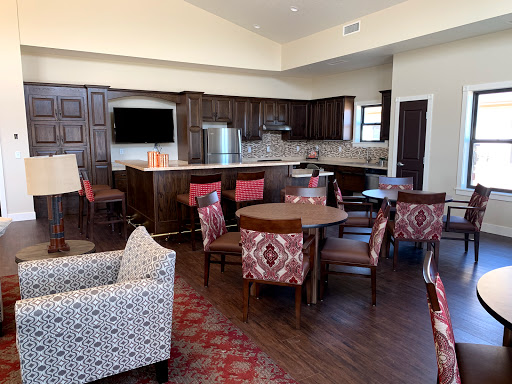 A modern and stylish interior featuring a kitchen and dining area with comfortable seating.