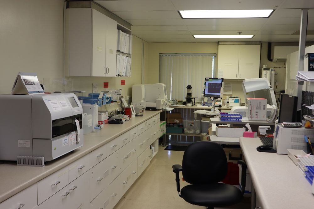 A laboratory workspace equipped with various scientific tools and equipment.