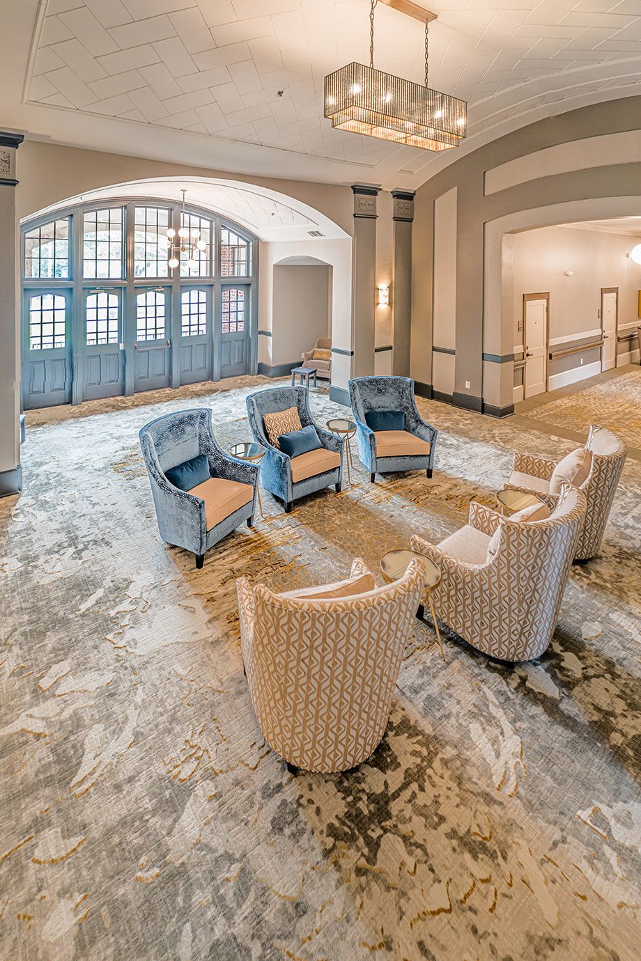 A cozy seating area with stylish armchairs in a modern lobby setting.