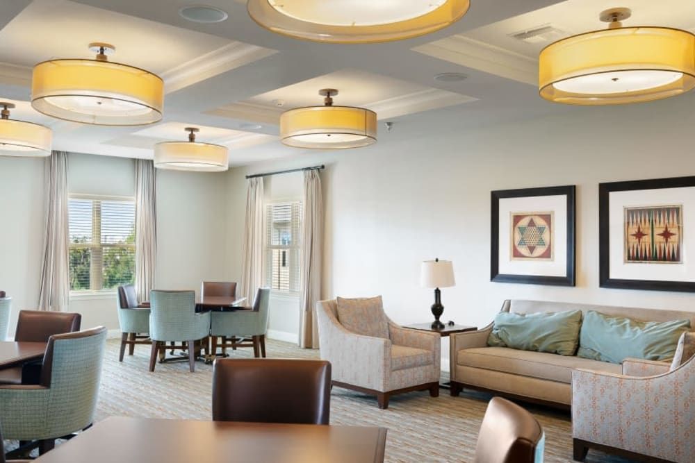 A modern living room with comfortable seating and stylish lighting.