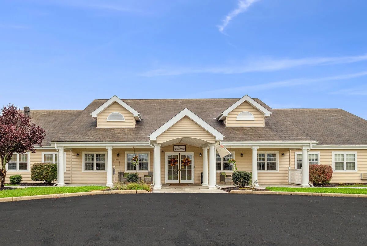 A suburban residential house with a symmetrical front and a well-maintained exterior.