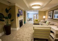 A cozy and modern living room interior with comfortable seating and warm lighting.