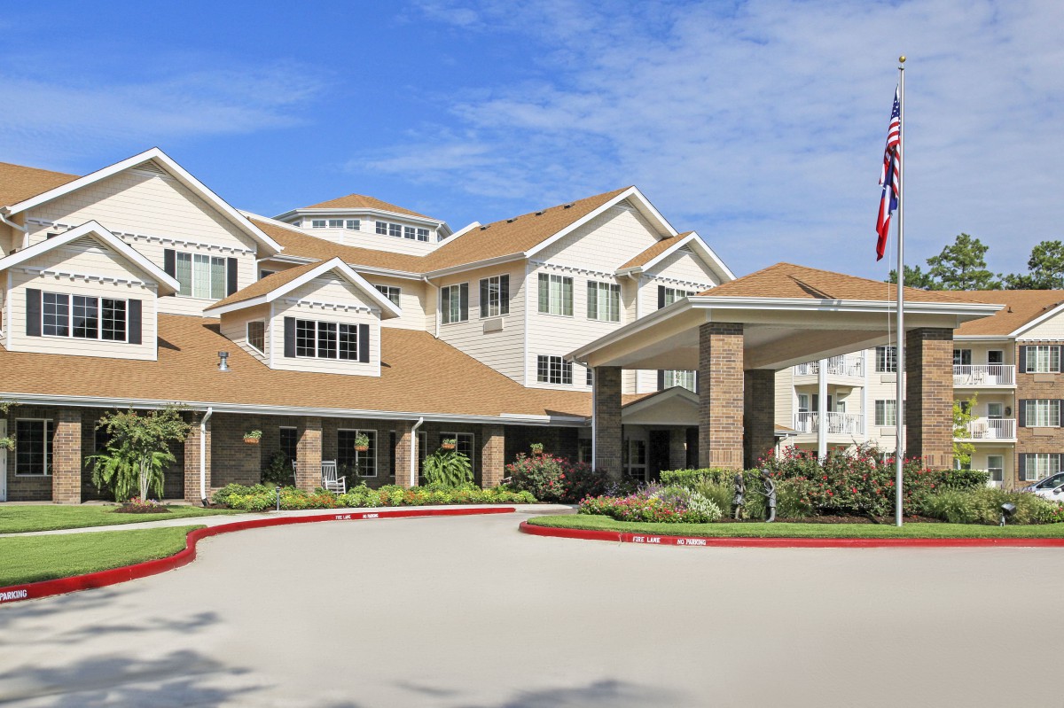 A senior living facility with well-maintained landscaping and a welcoming entrance.