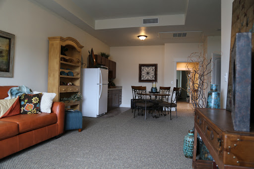 A cozy living room featuring a combination of dining and relaxation spaces.