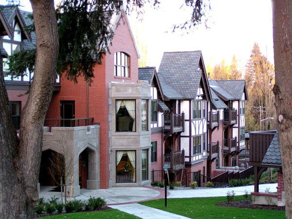 A row of modern residential buildings with varied architectural styles.