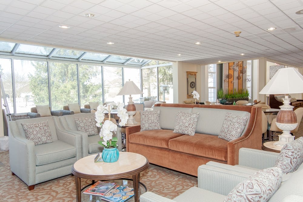 A bright and spacious living room with comfortable couches and a coffee table.