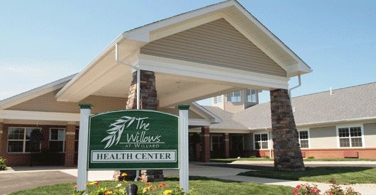 Entrance of a healthcare center with visible signage.