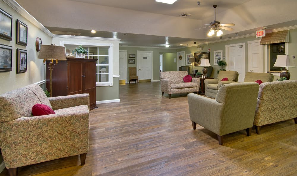A cozy living room with comfortable seating and wooden flooring.