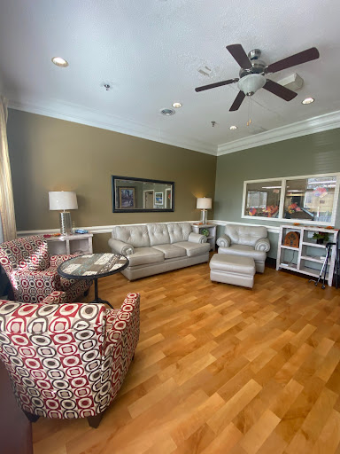 A cozy living room setup featuring comfortable seating and warm colors.