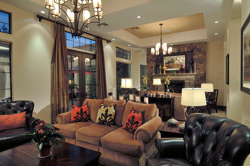 A cozy and elegantly decorated living room with warm lighting.