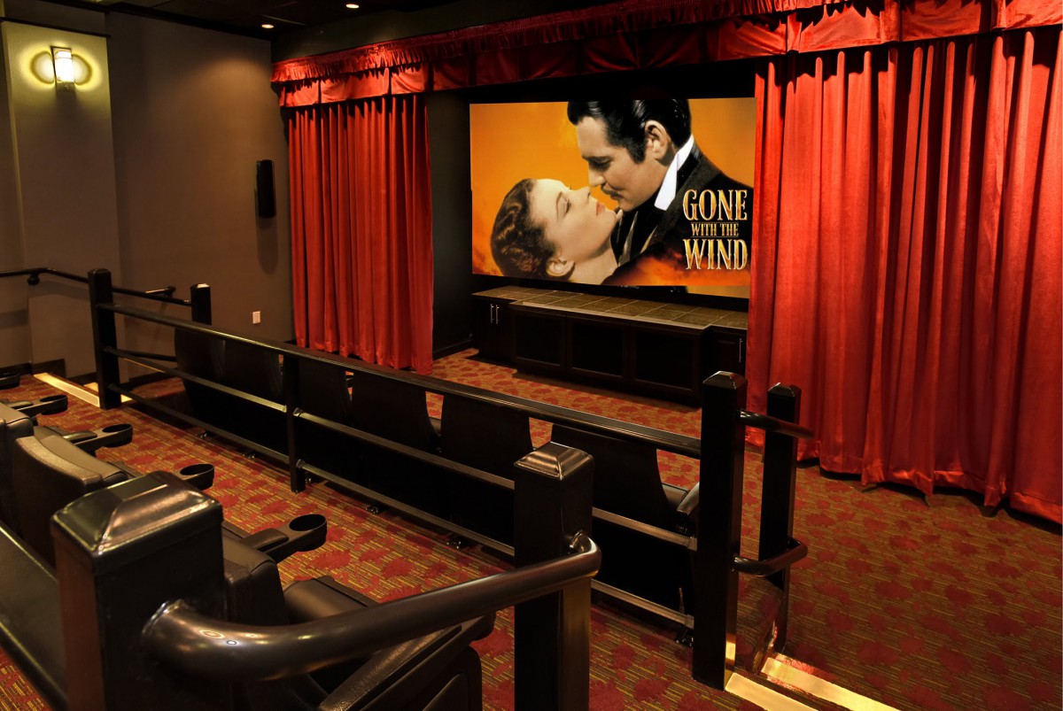 Interior of a movie theater featuring a screening of 'Gone with the Wind'.