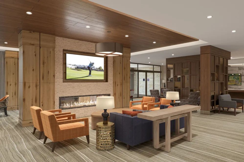 A modern living room with comfortable seating and wooden accents.