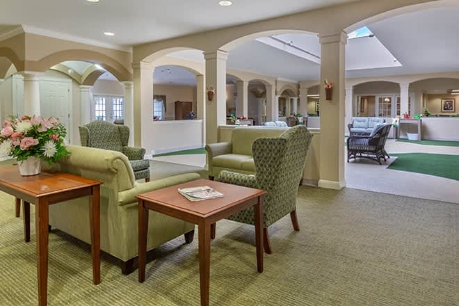 A cozy lobby with comfortable seating and elegant arches.