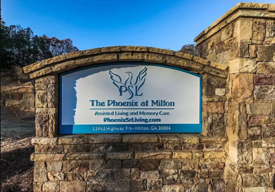 Sign for The Phoenix at Milton, an assisted living and memory care facility.