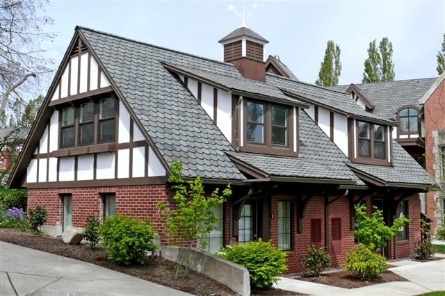 A Tudor-style house with a steep roof and brick exterior.