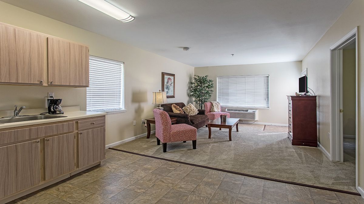 A cozy living room with comfortable seating and elegant decor.