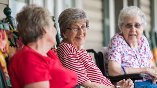 A joyful moment shared among friends in a relaxed outdoor setting.