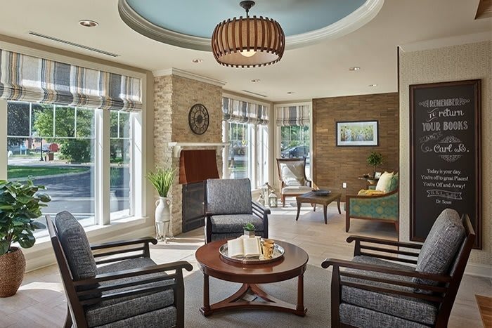 A beautifully lit modern living room with comfortable seating and stylish decor.