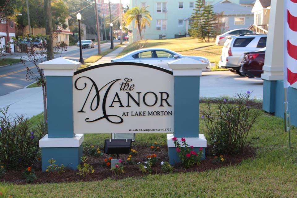 Sign for The Manor at Lake Morton located outdoors near a residential area.