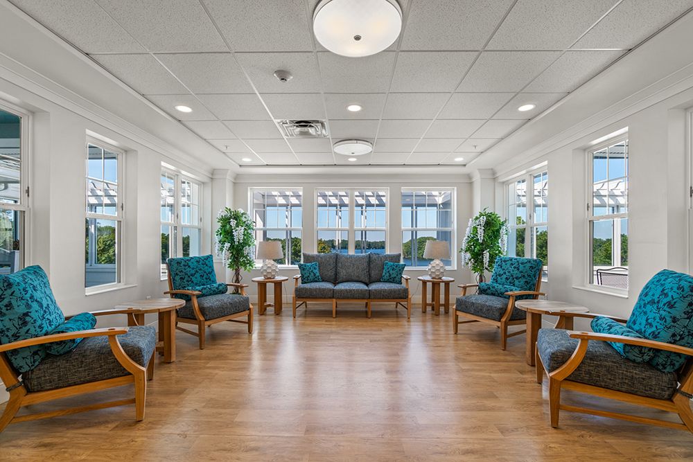 A well-lit and modern lobby area with comfortable seating and plants.