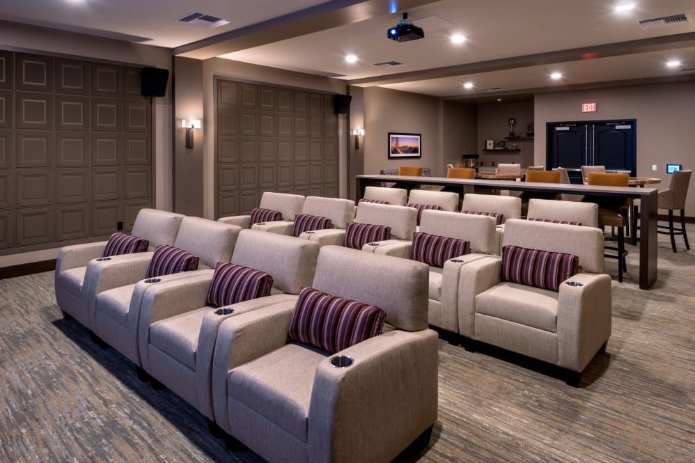 A luxurious home theater with comfortable seating and modern design.
