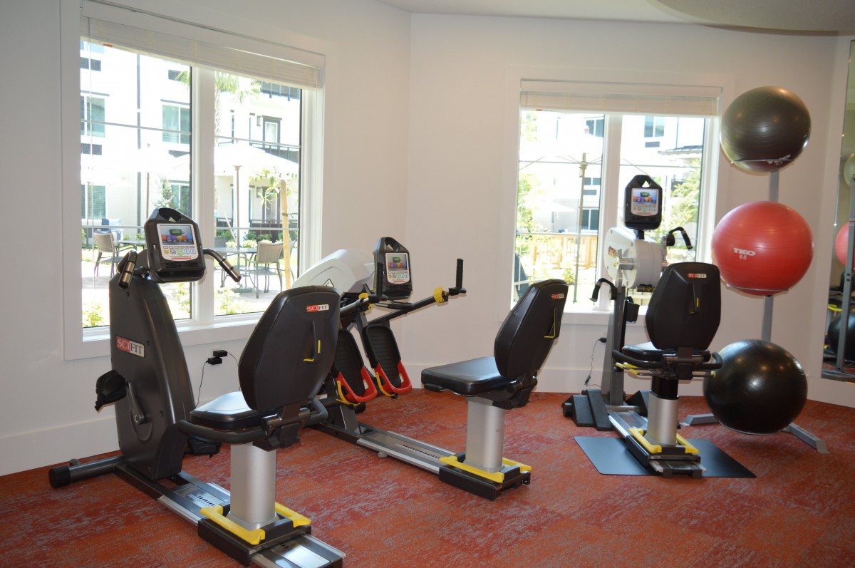 A compact fitness center with stationary bikes and exercise equipment.