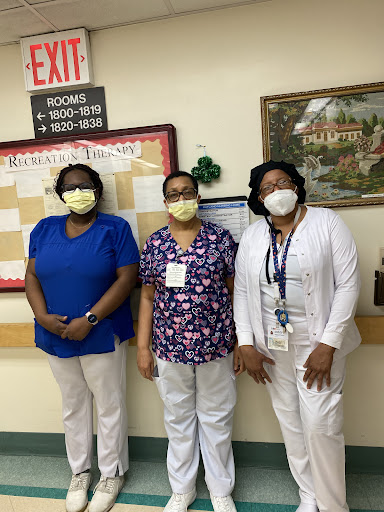 Healthcare professionals posing together, showcasing teamwork and dedication.