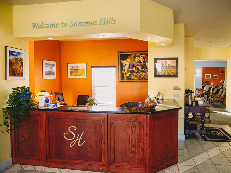 A welcoming reception area with a neatly arranged desk and vibrant decor.