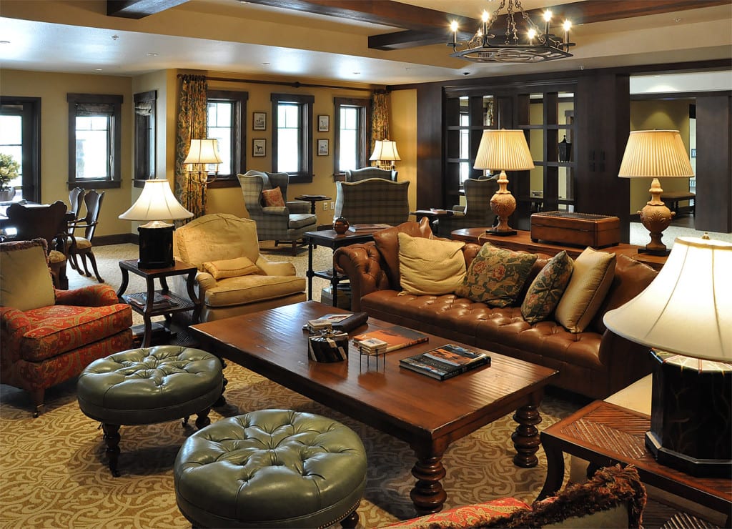 A luxurious and cozy living room featuring elegant furnishings and warm lighting.
